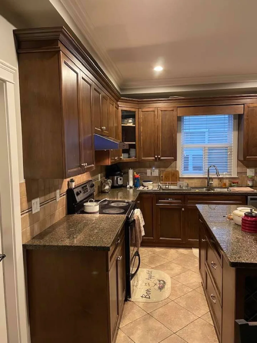 Dark brown kitchen cabinets before painting