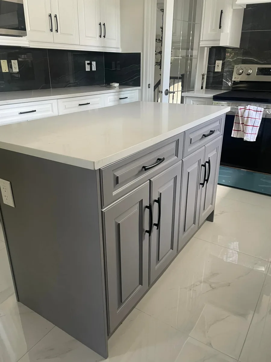 Grey painted kitchen island with white perimeter cabinets by Johhan Painting