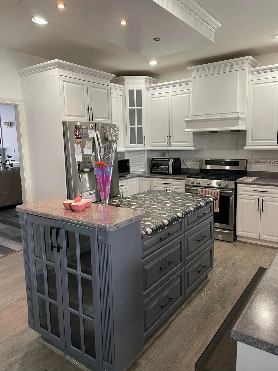 White painted kitchen cabinets with a grey painted island by Johhan Painting