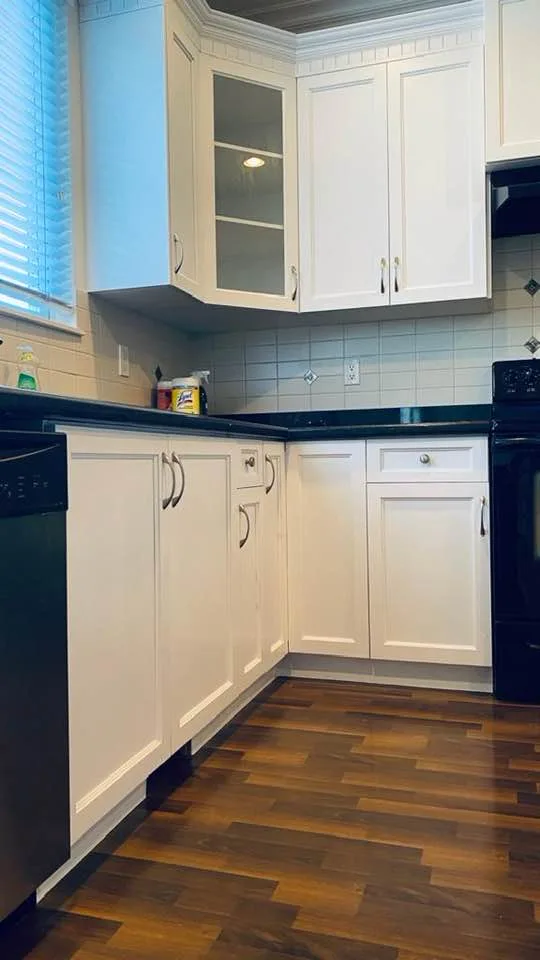 White painted kitchen cabinets by Johhan Painting