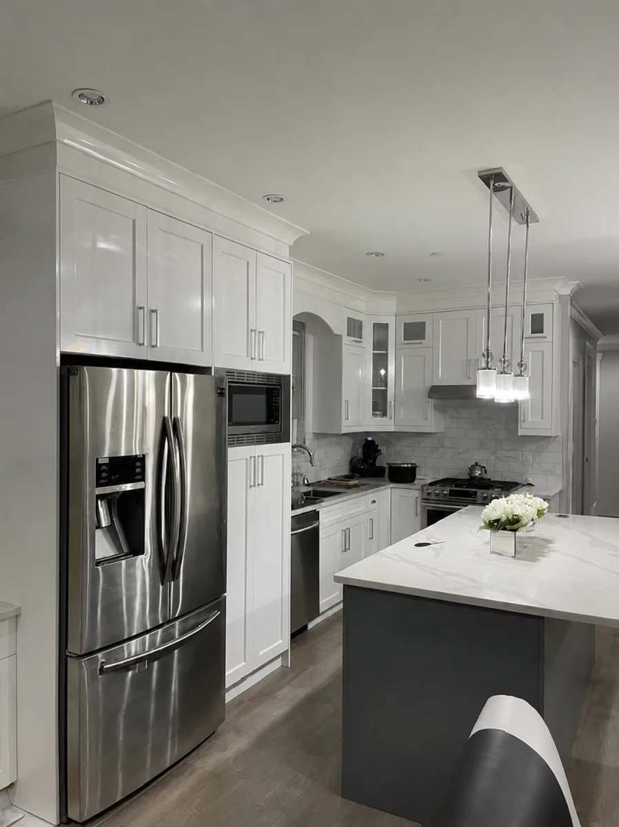 White painted kitchen cabinets with a grey painted island by Johhan Painting